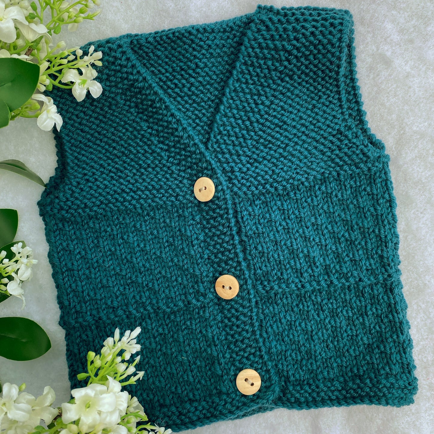 Knitting pattern: Cosmo baby vest - Nana Anna NZ