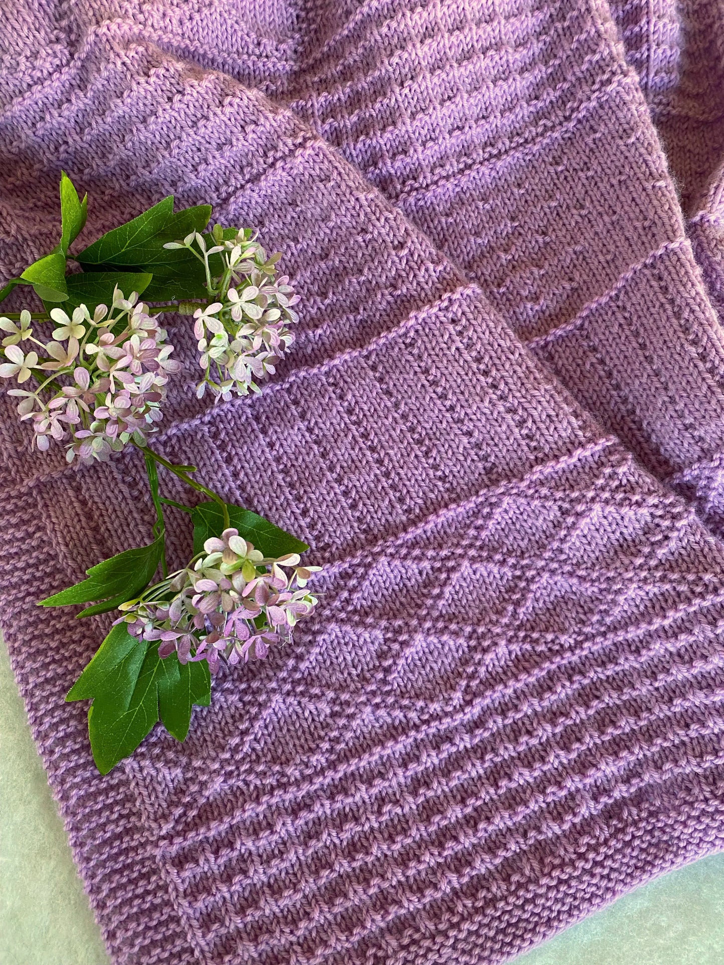 "Daisy" hand knit merino baby cot blanket