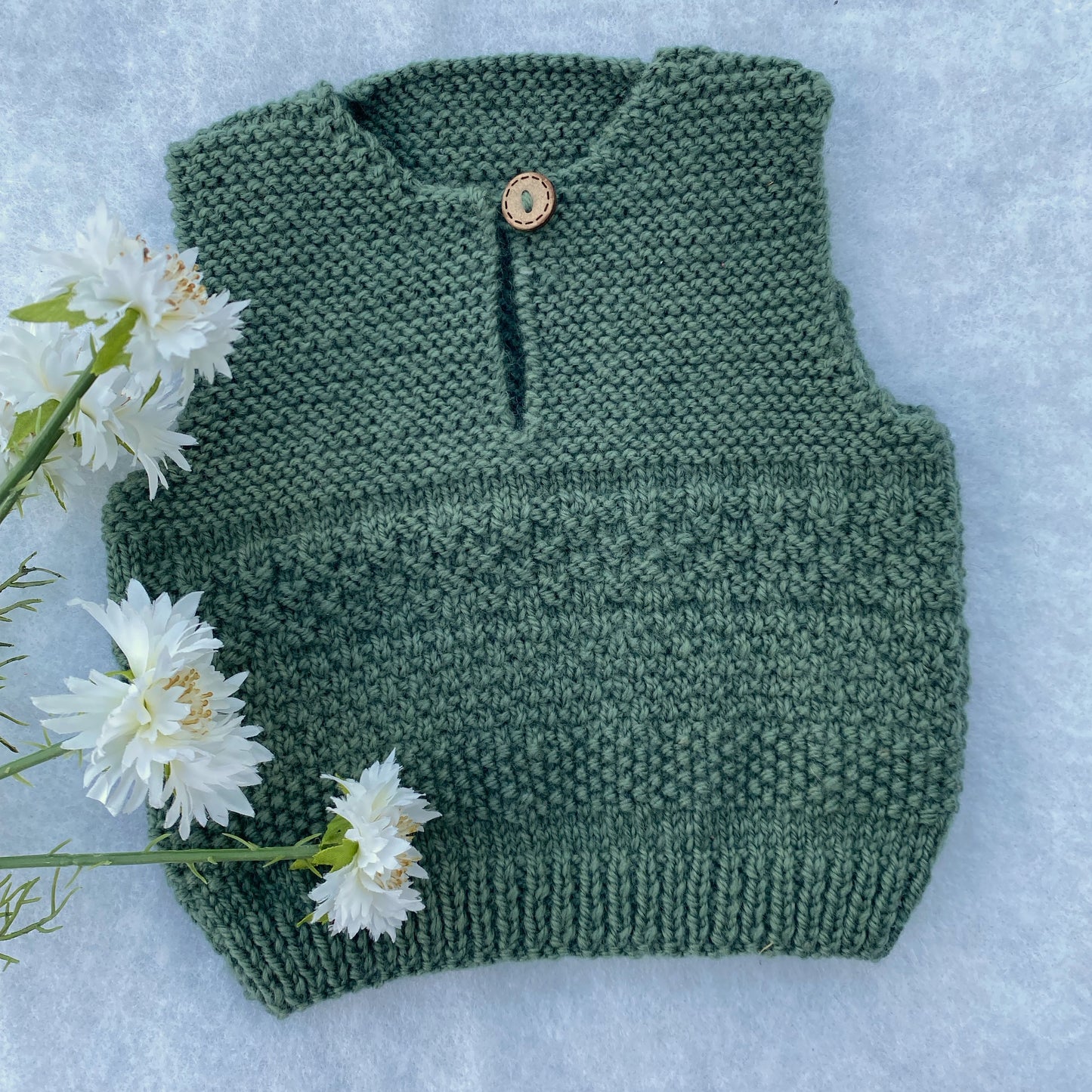 "Phoenix" hand knit merino baby vest
