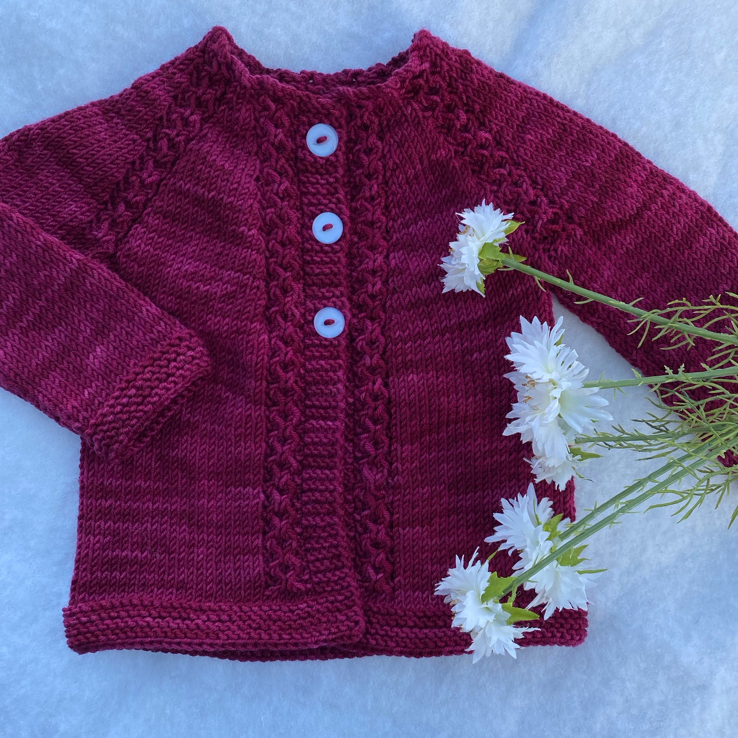 Hand knit merino baby cardigan - Falcon in Tauberry