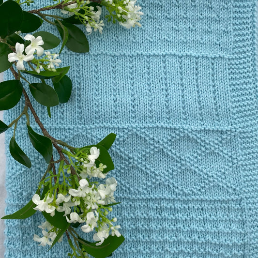 "Daisy" hand knit merino baby cot blanket