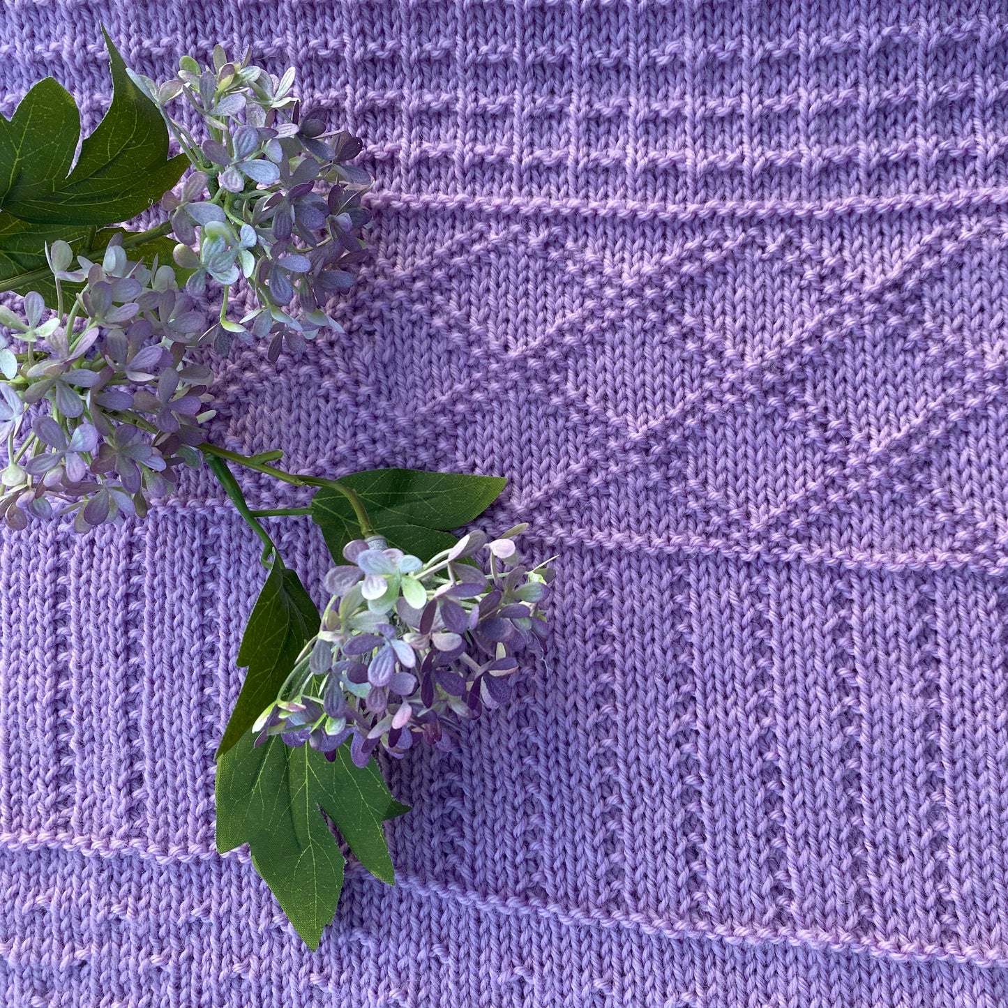 "Daisy" hand knit merino baby cot blanket