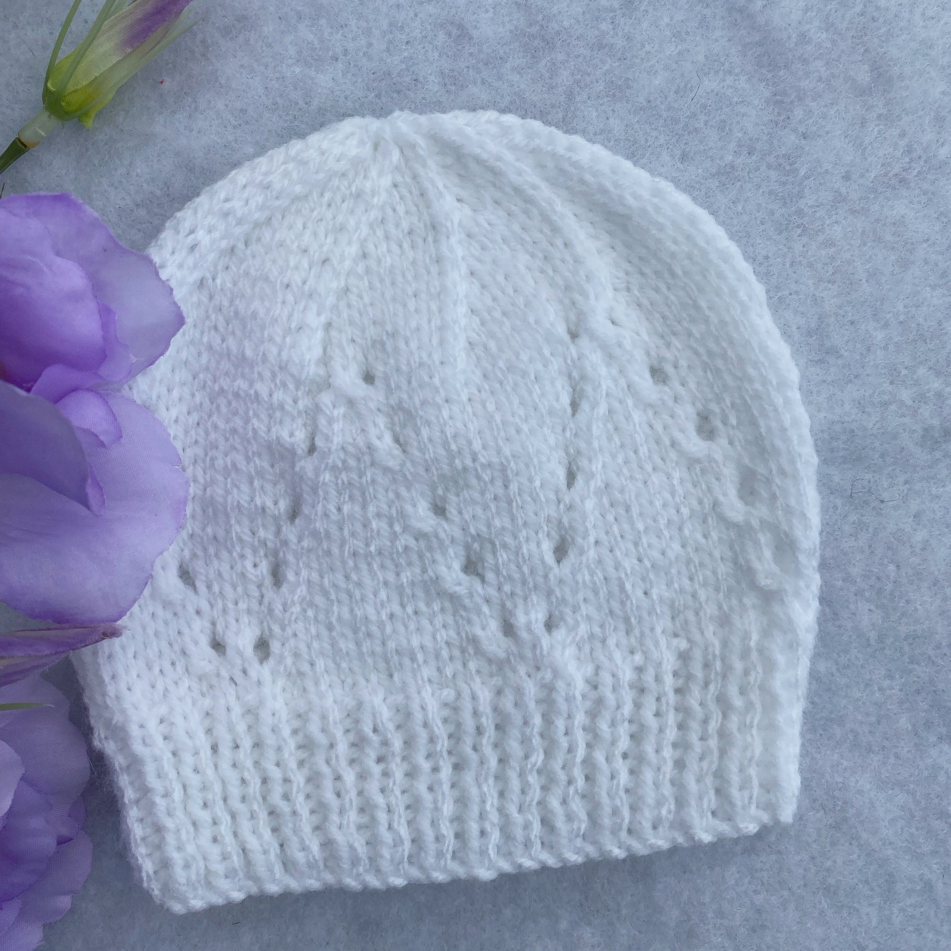 Eyelet merino baby hat
